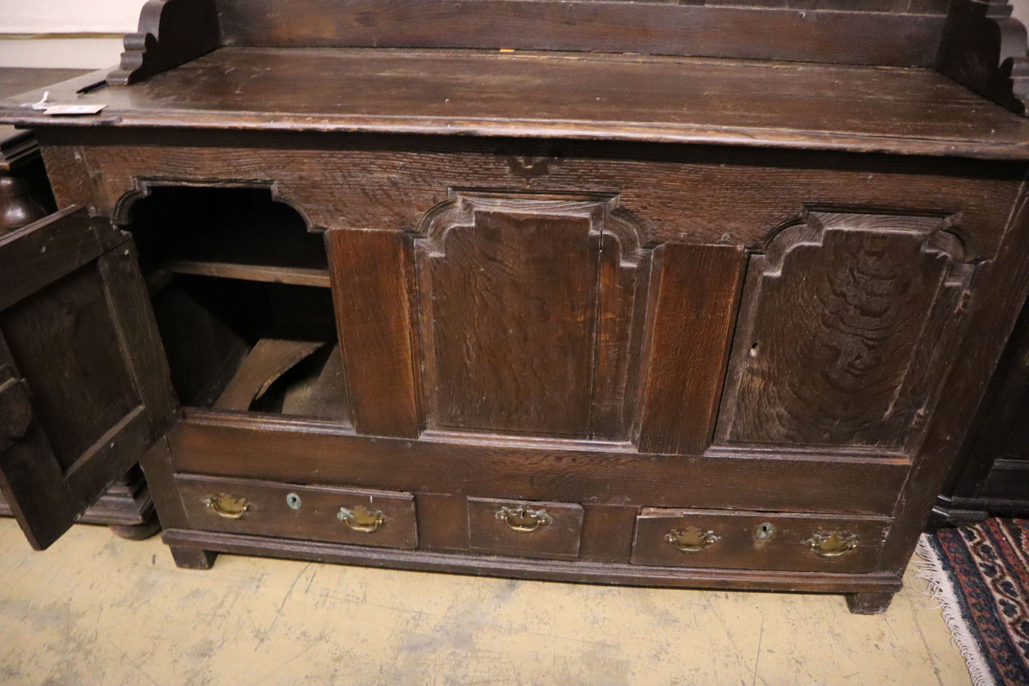 An 18th century oak mule chest with associated rack, width 151cm, depth 54cm, height 180cm